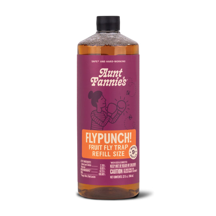 A bottle of Aunt Fannie’s FlyPunch! Fruit Fly Trap Refill Size with a purple label featuring an illustration of a woman and orange text highlighting its use for trapping fruit flies.