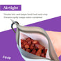 Airtight Pet Treat Bag + Carabiner by (re)zip filled with chopped sausages. Double lock seal keeps treats fresh and crisp. Water-resistant, perfect as a dog bag or treat pouch for any leash accessory. (re)zip logo in the corner.
