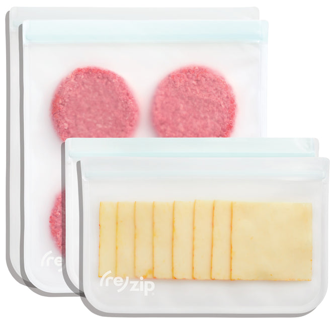 The (re)zip Reusable 2 Gallon + 2 Half Gallon Bag Set includes clear, BPA-free PEVA bags with white zip closures—shown storing burger patties and cheese slices for secure, leakproof food storage.