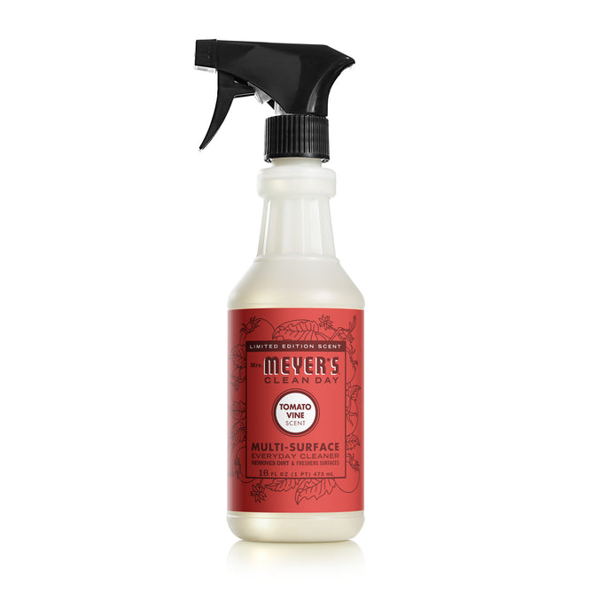 The Mrs. Meyers Multi-Surface Cleaner in Tomato Vine scent, a limited edition with a red floral label, features essential oils and a user-friendly black spray nozzle for easy cleaning.