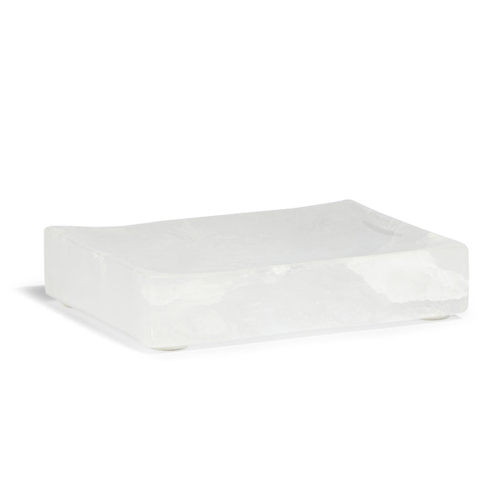 A rectangular, translucent white soap dish with slightly raised edges and a smooth surface, made of crystal-like material.