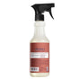 A bottle of Mrs. Meyers Multi-Surface Cleaner features a black nozzle and brown label emphasizing its cruelty-free formula, isolated on a white background, ready to tackle messes with eco-friendly care.