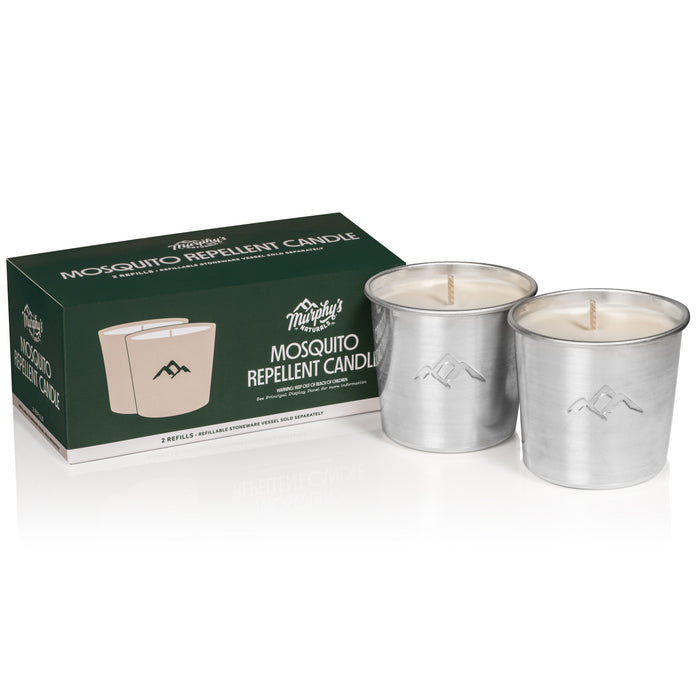 A green and white box labeled Murphys Naturals Mosquito Repellent Candle sits beside two metal tin candles filled with white wax. The candles and packaging are positioned against a white background.