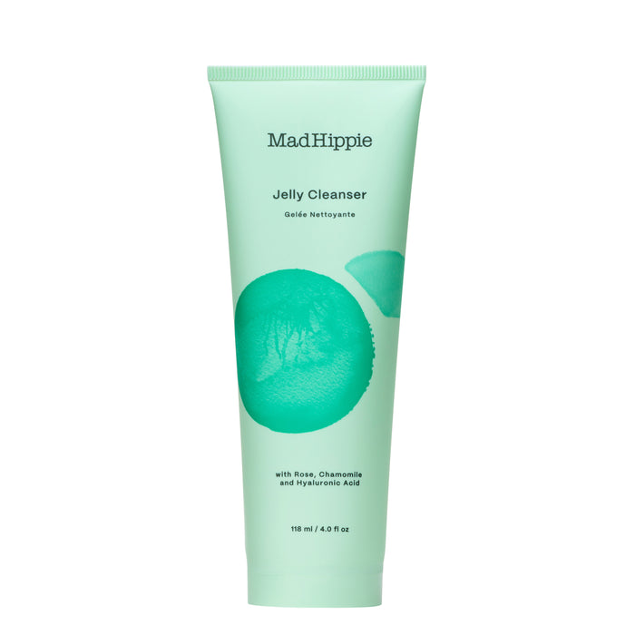 A mint green tube of Mad Hippie Jelly Cleanser, featuring minimalist text and a teal circular design. The label mentions rose, chamomile, hyaluronic acid, and the size is 118 ml (4.0 fl oz).