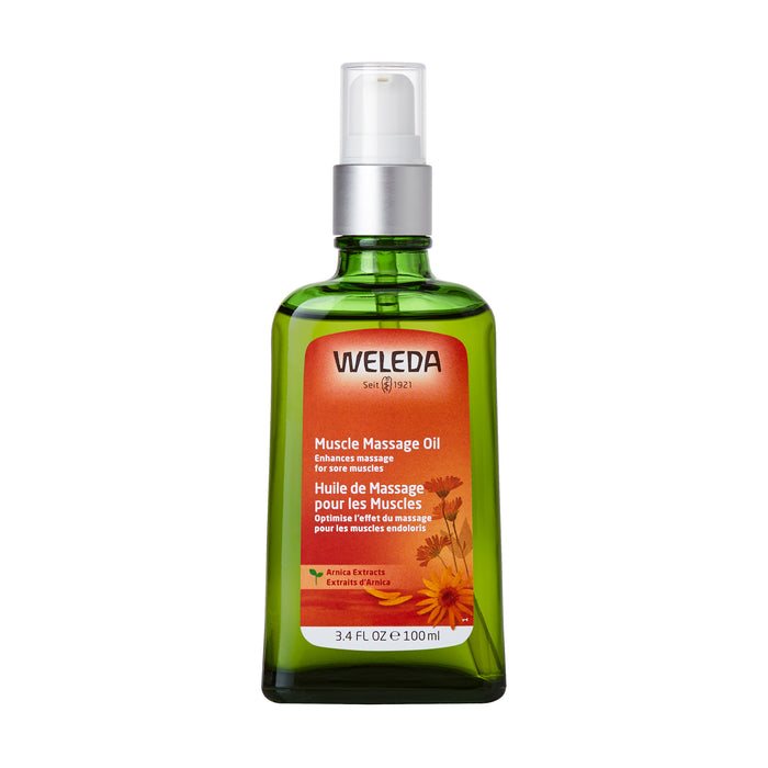 A green glass bottle of Weleda Muscle Massage Oil with a white pump dispenser. The label is orange with text in English and French, and features images of arnica flowers. The bottle contains 3.4 fl oz (100 ml).