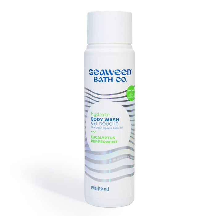 A white bottle of Seaweed Bath Co. Hydrate Body Wash in Eucalyptus and Peppermint scent, with silver wavy lines and blue, green, and purple text on the label. The bottle is 12 fl oz (354 mL).