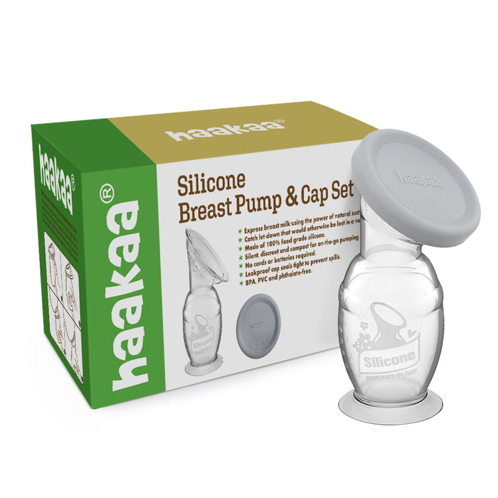 A Haakaa Silicone Breast Pump & Cap Set is displayed, showing a clear silicone breast pump with a grey lid next to its green and white box featuring the product name and illustrations.