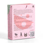Back of a pink soap box with text about the product, usage instructions, brand information, and symbols for vegan, sustainably sourced, no animal testing, and plastic-free. A QR code is visible on the bottom right corner.