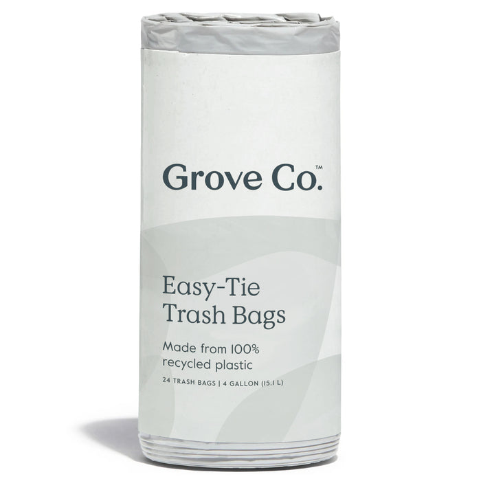 A roll of Grove Co. Easy-Tie Trash Bags, labeled as made from 100% recycled plastic. The package contains 24 trash bags, each with a 4-gallon (15.1 L) capacity.