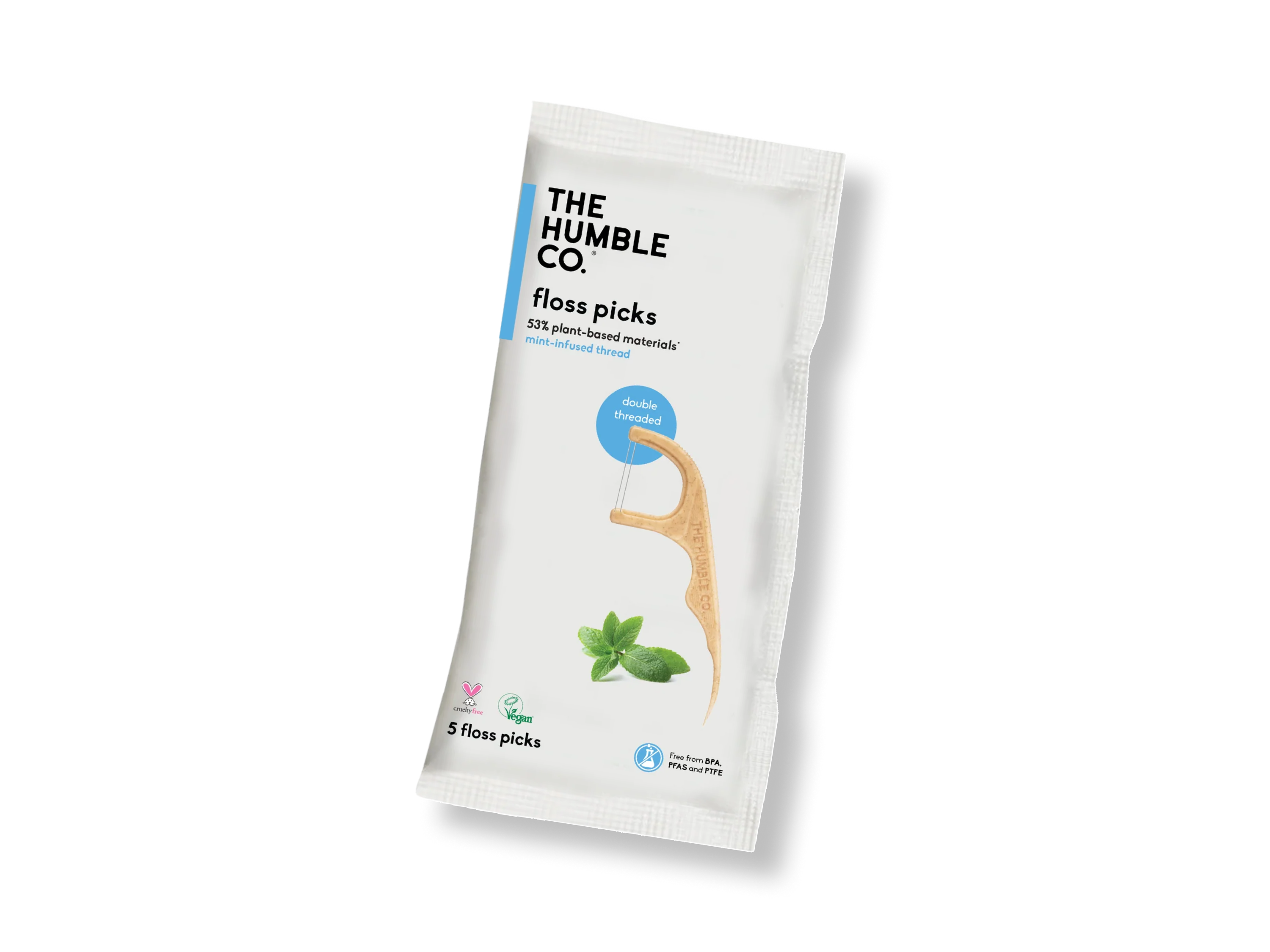 A white packet of The Humble Co. floss picks, featuring a bamboo-handled pick, mint leaves, and icons for vegan, cruelty-free, and eco-friendly. The packet contains 5 floss picks and is labeled as plant-based and mint-flavored.