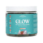 A jar of Akasha Superfoods Sea Moss GLOW Gummies features a turquoise label and organic ingredients—Irish Sea Moss, pearl powder, vitamin C, and aloe vera—for radiant skin and beauty.