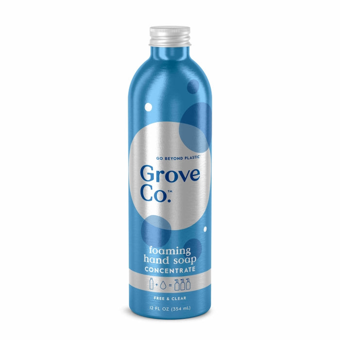 The Grove Co. Foaming Hand Soap Refill, in a stylish blue metallic 12 fl oz (354 ml) bottle with circular designs, features Go Beyond Plastic and Free & Clear labels. Its sustainable packaging makes it both eco-friendly and chic for any setting.