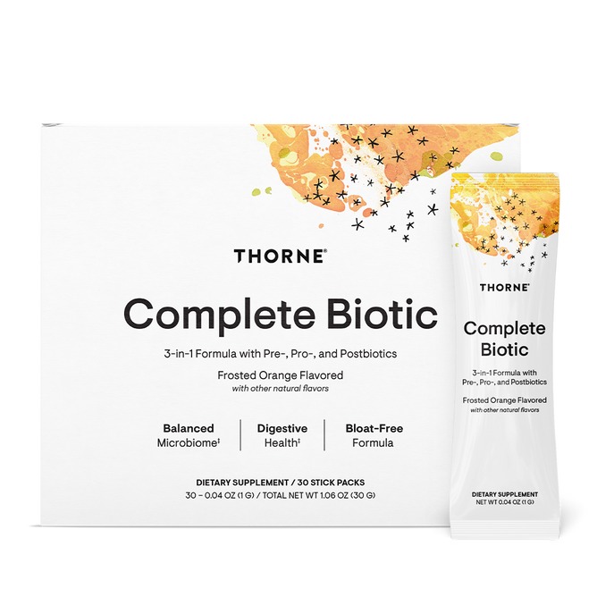 Box and sachet of Thorne Complete Biotic Powder Packets, 3-in-1 Formula—a gut health dietary supplement with pre-, pro-, and postbiotics. White packaging features orange/yellow abstract art, black stars, and is labeled Frosted Orange Flavored.
