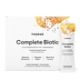 Box and sachet of Thorne Complete Biotic Powder Packets, 3-in-1 Formula—a gut health dietary supplement with pre-, pro-, and postbiotics. White packaging features orange/yellow abstract art, black stars, and is labeled Frosted Orange Flavored.