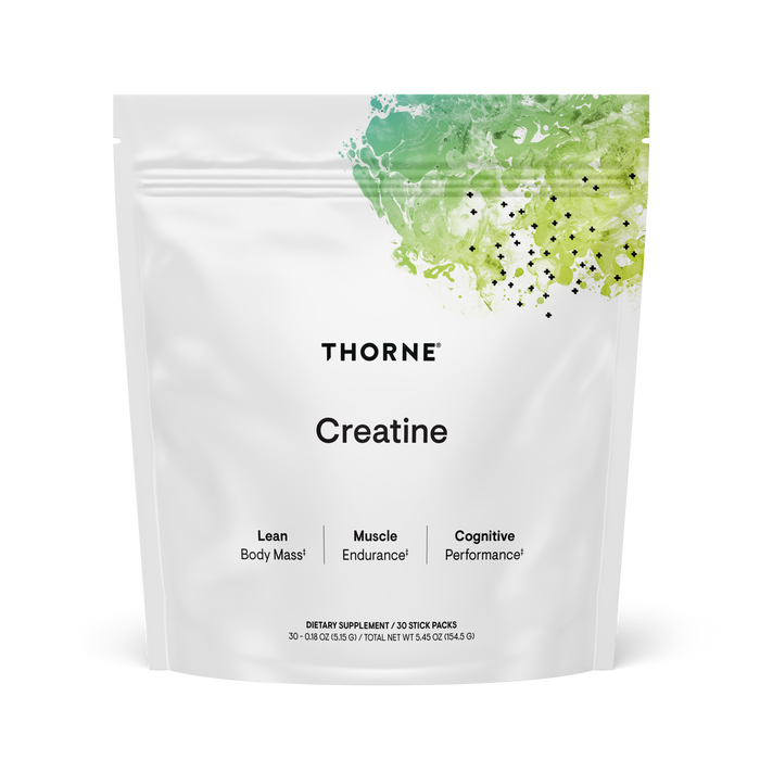 A white pouch of Thorne Creatine supplement with green watercolor design on top. The package highlights benefits such as lean body mass, muscle endurance, and cognitive performance.