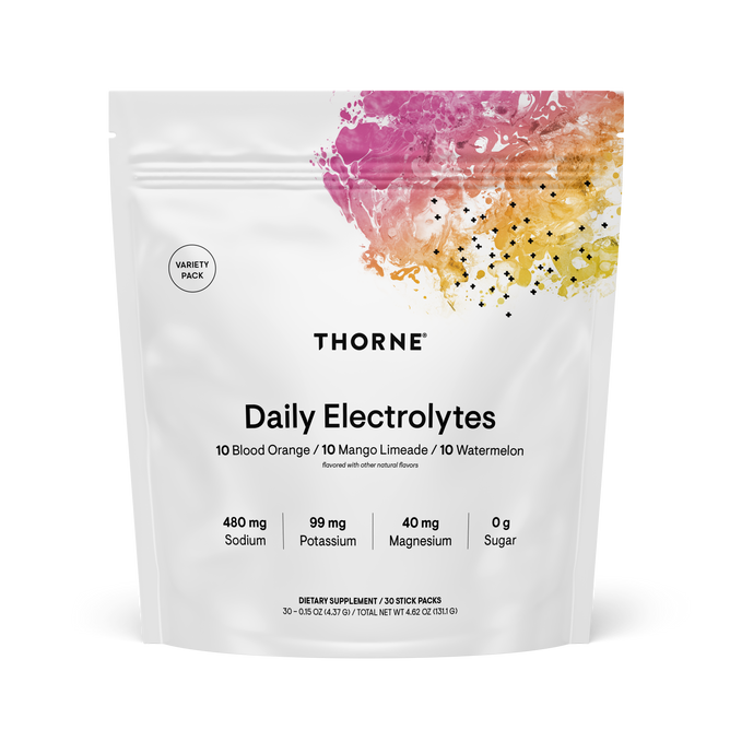A white Thorne Daily Electrolytes pouch features a colorful abstract top design. The label highlights Blood Orange, Mango Limeade, and Watermelon flavors plus sodium, potassium, magnesium for hydration—all with 0g sugar.