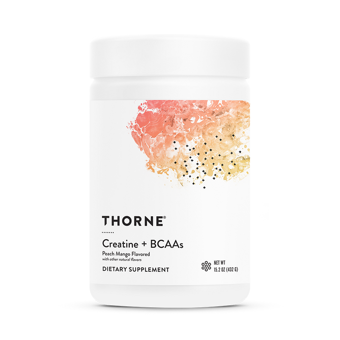 A white container of Thorne Creatine + BCAAs, peach mango flavored, features a colorful abstract label with black text highlighting its support for strength and endurance.