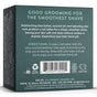 Back of Shave Bar - Smooth & Moisturize box from Badger Balm with product details, directions, barcode, certifications (including certified B Corp), and ingredients. Text highlights smooth shaving and hydration with shea butter and coconut oil. This plastic-free, cruelty-free shaving soap bar is moisturizing.