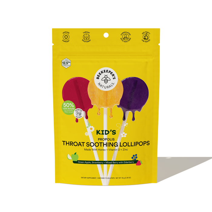 A yellow pouch of Beekeepers Naturals Kid’s Propolis Throat Soothing Lollipops, featuring images of three colorful lollipops and text highlighting honey, vitamin D, zinc, and mixed berry with elderberry flavor.