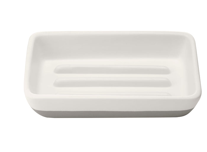 A rectangular, white ceramic soap dish with raised ridges and a smooth surface, viewed from above against a white background.
