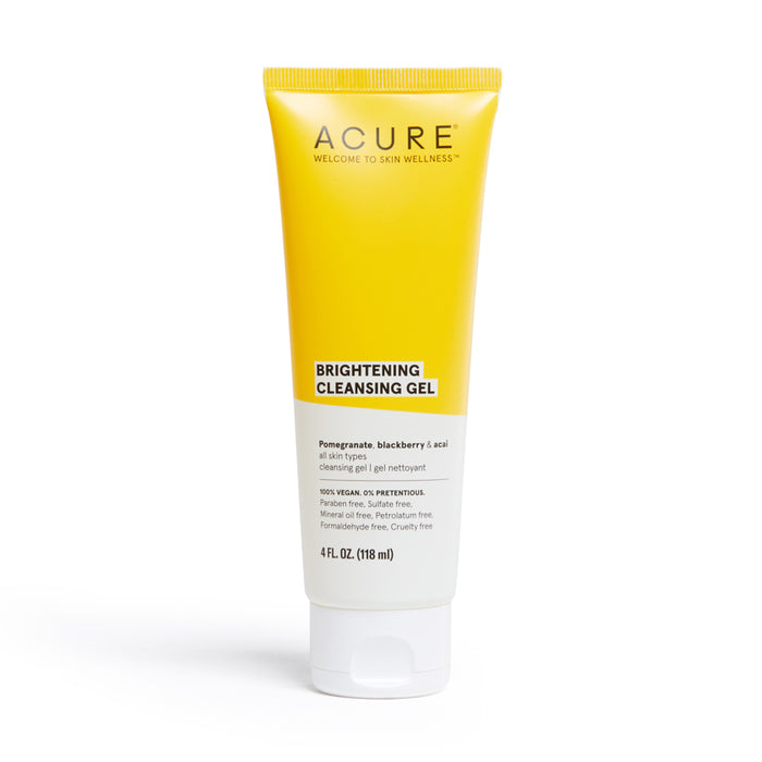 A yellow and white tube of Acure Brightening Cleansing Gel stands upright on a white background. The label highlights key ingredients: pomegranate, blackberry, and acai, and notes it is vegan and cruelty-free.