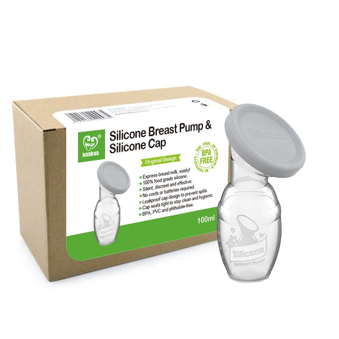 A Haakaa Silicone Breast Pump with a silicone cap is displayed in front of its brown and green product box, which features an image of the pump and various product details, including a BPA-free label.