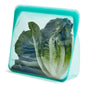 Fresh, green lettuce is stored in a turquoise Reusable Stand-Up Mega Bag by Stasher. This silicone bag with a patented Pinch-Loc™ seal stands upright and remains partially transparent, displaying the crisp texture inside. Its a practical, eco-friendly alternative to plastic.