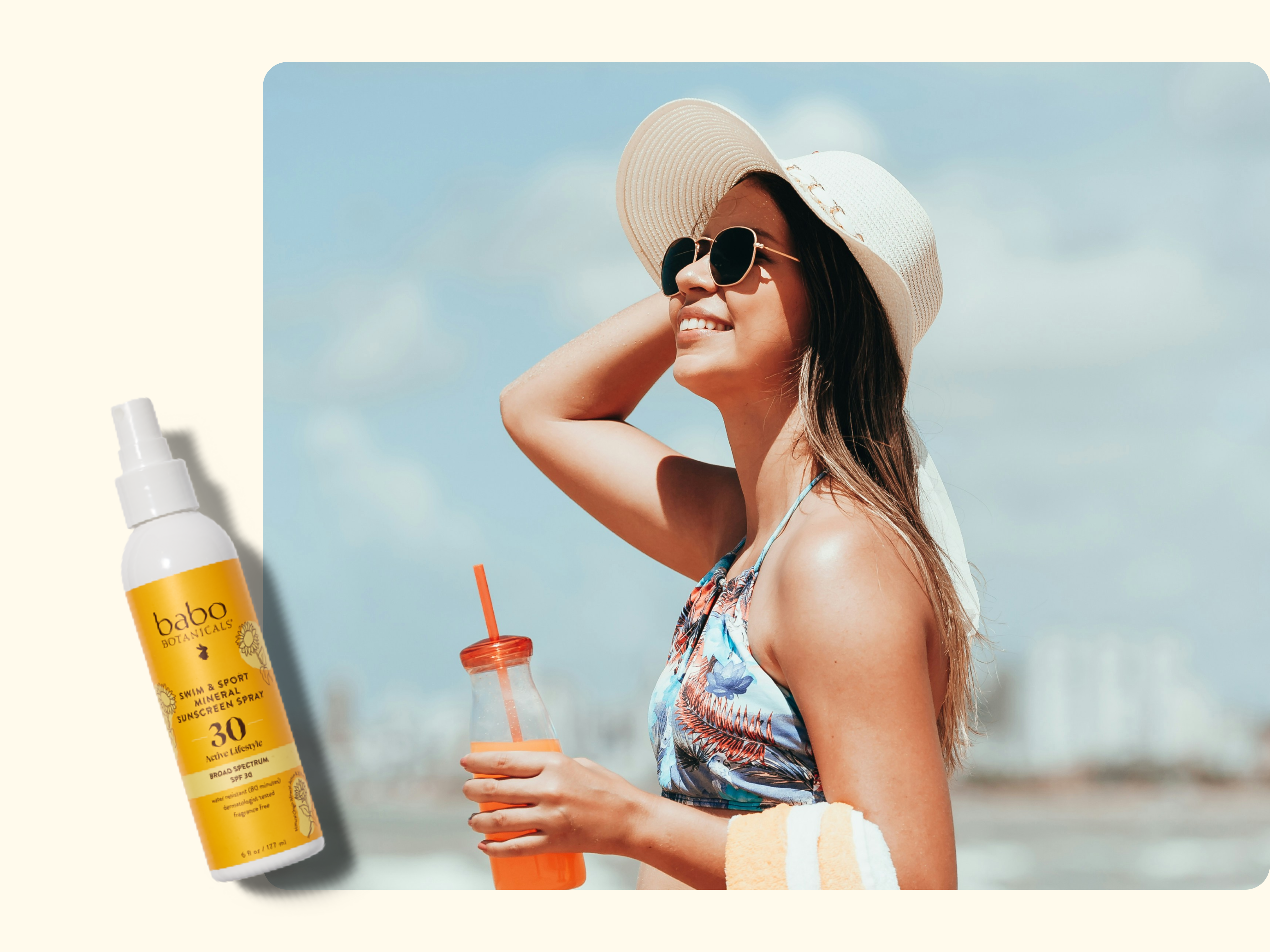A smiling woman wearing sunglasses and a sunhat stands on the beach holding a drink and towel. A bottle of Babo Botanicals SPF 30 sunscreen is displayed on the left side of the image.