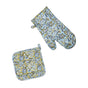 The Supra Endura Hand Block Printed Ovenmitt And Pot Holder Set is shown on a white background, featuring blue, yellow, and black floral designs.