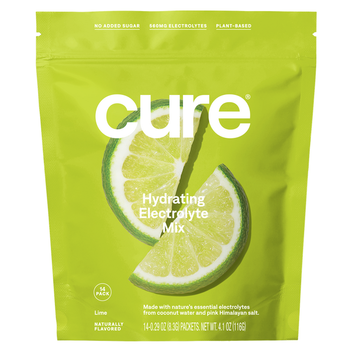 A bright green pouch of Cure Hydrating Electrolyte Mix, featuring two lime slices on the front. The packaging notes it contains no added sugar, 850 mg electrolytes, is plant-based, and includes 14 packets.