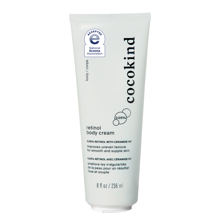 A white tube of Cocokind retinol body cream with ceramide NP, featuring product details and an acceptance seal from the National Eczema Association. The tube contains 8 fl oz (236 ml).