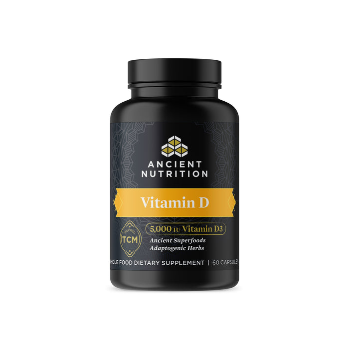 A black bottle of Ancient Nutrition Vitamin D supplement with a gold label showing 5,000 IU Vitamin D3, Ancient Superfoods, Adaptogenic Herbs, and 60 capsules.