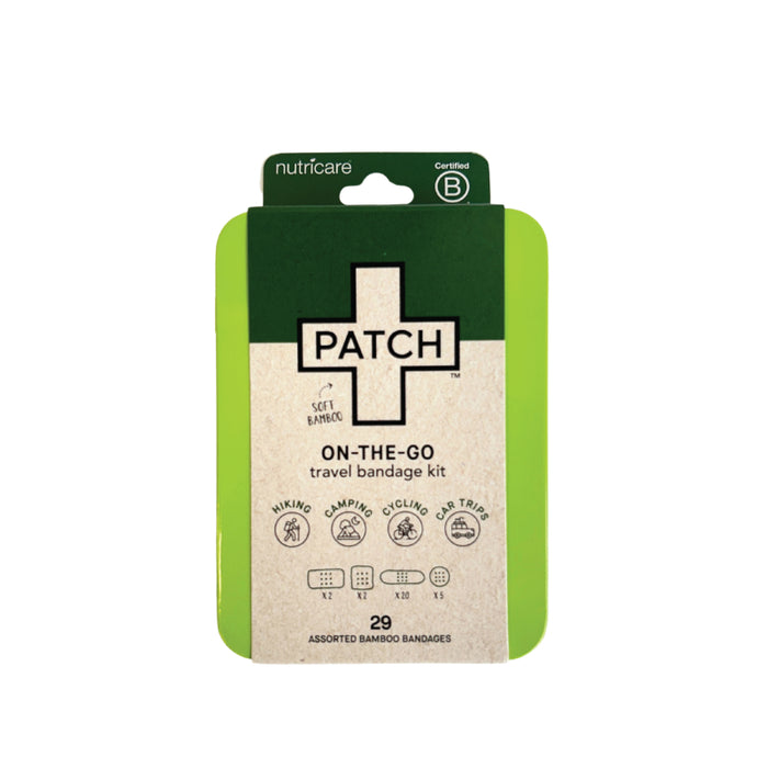 A travel bandage kit called PATCH ON-THE-GO in green and tan packaging. The label mentions its for hiking, camping, cycling, and car trips, and contains 29 assorted bamboo bandages.