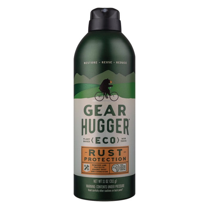 A can of Gear Hugger Eco Rust Protection spray with a green and beige label featuring a cyclist silhouette on a hill, emphasizing plant-based, non-toxic, and eco-friendly rust protection.