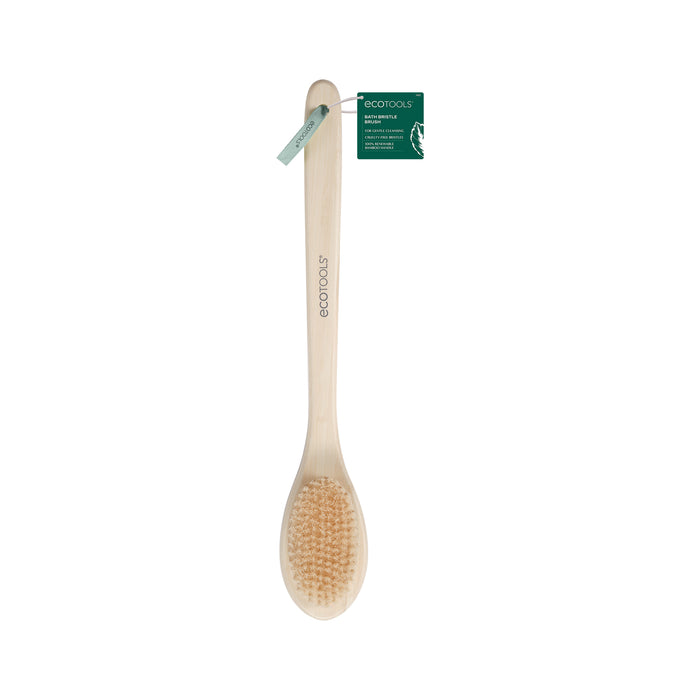 A long-handled wooden bath brush with natural bristles and a green product tag attached near the top, displayed on a white background.
