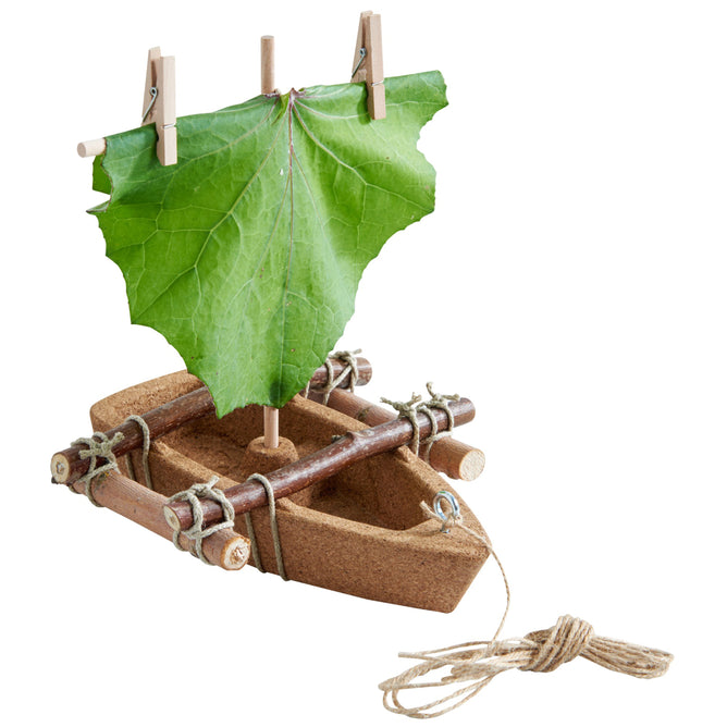The HABA Terra Kids Cork Boat DIY Activity Kit is an award-winning, eco-friendly toy for kids ages 5+, featuring a handmade cork raft, leaf sail, wooden mast with clothespins, and sticks tied with twine—perfect for creative play.