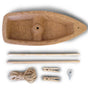 The HABA Terra Kids Cork Boat DIY Activity Kit (award-winning, 5+ years) includes a cork hull, wooden dowels, string, clothespins, and a metal eye screw—eco-friendly components ready to assemble on a white surface.