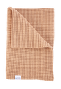 Folded terracotta-colored waffle-knit The Popcorn - Henna heirloom baby blanket made from superfine merino wool.