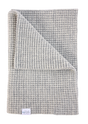 A folded light gray, waffle-knit AU Baby The Popcorn Blanket - Moon Stone, featuring a white label in the corner.