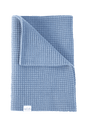 Sky Blue The Popcorn Blanket in light blue superfine merino with a textured waffle pattern, folded over at the top corner.