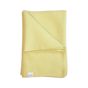 Folded pale yellow The Sawa - Citron merino baby blanket with a subtle textured pattern and personalized embroidery.