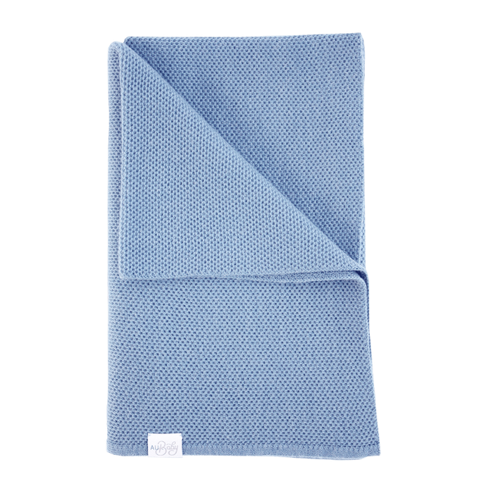 Folded sky blue The Sawa merino baby blanket with a subtle textured pattern and personalized embroidery.
