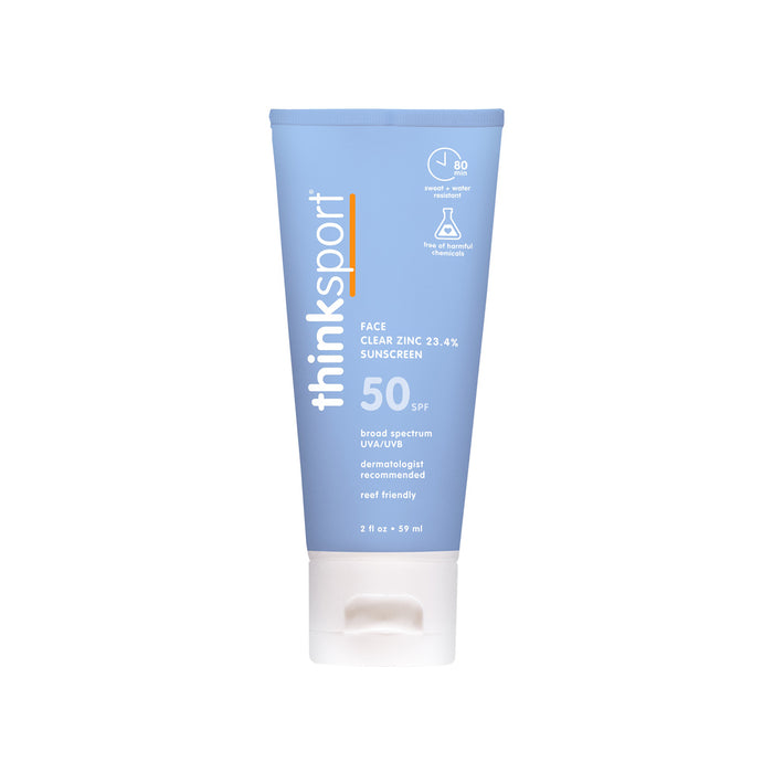 A blue tube of thinksun thinksport SPF 50 Clear Zinc Active Face sunscreen with a white cap. The label features its chemical-free, reef friendly formula, broad-spectrum UVA/UVB protection, and up to 80 minutes water resistance.