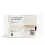 Packaging of a Grove Co. Coconut Scrubber Sponge in white and beige reads: Im a tough scrubber with a soft touch! Its non-abrasive, top-rack dishwasher safe, and responsibly made in Canada.
