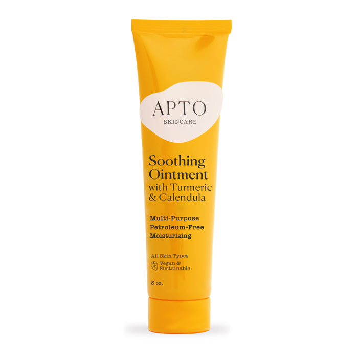 A yellow tube of APTO Skincare Soothing Ointment with Turmeric & Calendula, labeled as multi-purpose, petroleum-free, moisturizing, for all skin types, vegan, and unscented, 3 oz size.