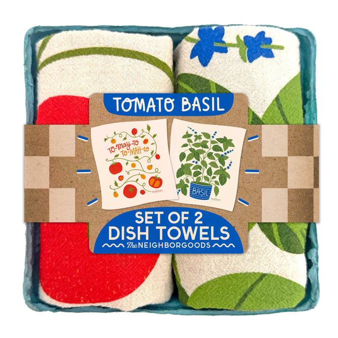 The Neighborgoods Dish Towel Set features two rolled cotton towels in a blue carton labeled TOMATO BASIL, SET OF 2 DISH TOWELS, decorated with tomatoes, basil leaves, and recipe cards—an ideal giftable kitchen towel set.