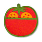 The Neighborgoods Pot Holder - Tomato: a red and green cotton pot holder shaped like a tomato, with a handy pocket and two yellow tomato slice details—an adorable kitchen essential.