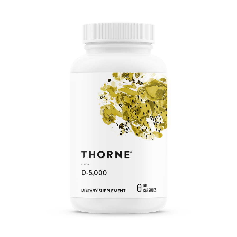 A white bottle labeled Thorne Vitamin D-5000 contains 60 capsules of a Vitamin D3 supplement to support immune function, featuring an abstract design with gold and green splashes.