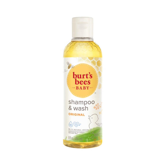 A bottle of Burt’s Bees Baby Shampoo & Wash, Original scent. The label features a yellow honeycomb design, a bee illustration, and a white background with simple childlike graphics. The bottle contains 8 fl oz (236 mL).