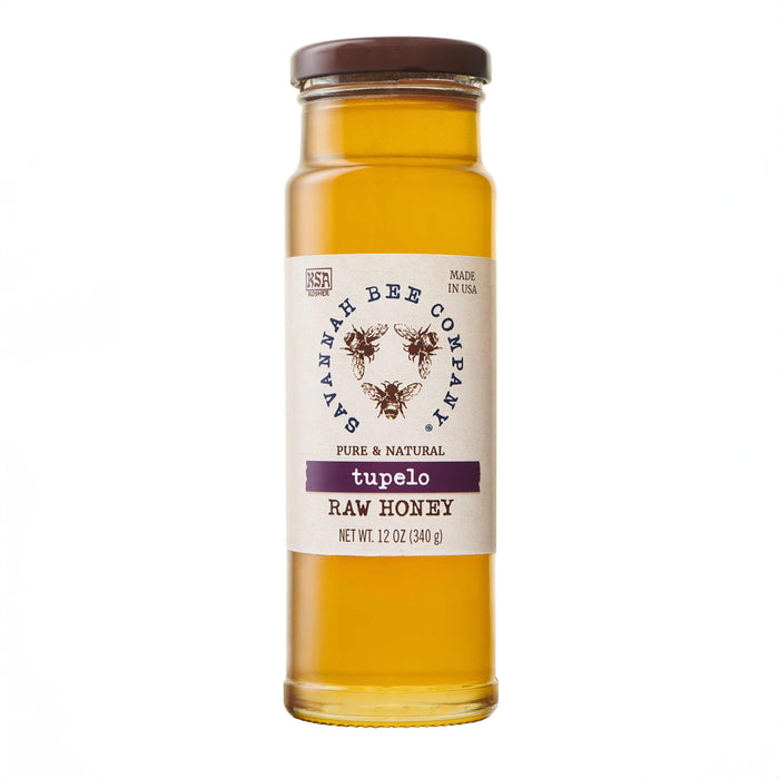 Savannah Bee Companys Tupelo Honey, in an artfully designed 12 oz glass jar with bee graphics, boasts a buttery flavor and pure, natural amber color, reflecting expert beekeeping craftsmanship.